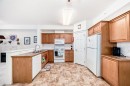 446-15 Everstone Drive Sw, Calgary, AB  - Indoor Photo Showing Kitchen With Double Sink 
