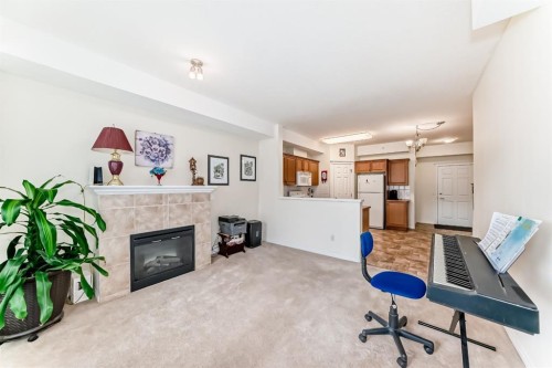 446-15 Everstone Drive Sw, Calgary, AB - Indoor With Fireplace