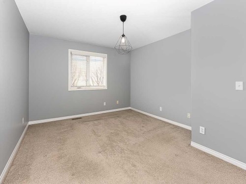 172 Simcoe Place Sw, Calgary, AB - Indoor Photo Showing Other Room