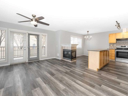 172 Simcoe Place Sw, Calgary, AB - Indoor With Fireplace