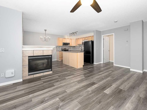 172 Simcoe Place Sw, Calgary, AB - Indoor With Fireplace