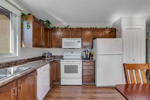 20 Ogmoor Crescent Se, Calgary, AB - Indoor Photo Showing Kitchen With Double Sink