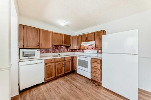 6840 4 Avenue Ne, Calgary, AB - Indoor Photo Showing Kitchen With Double Sink