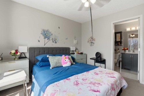 227 Copperpond Row Se, Calgary, AB - Indoor Photo Showing Bedroom