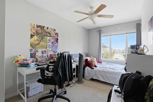 227 Copperpond Row Se, Calgary, AB - Indoor Photo Showing Bedroom