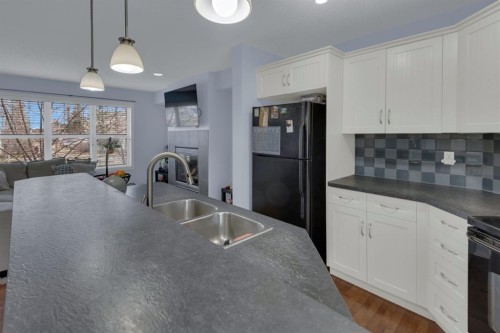 273 Eversyde Boulevard Sw, Calgary, AB - Indoor Photo Showing Kitchen With Double Sink
