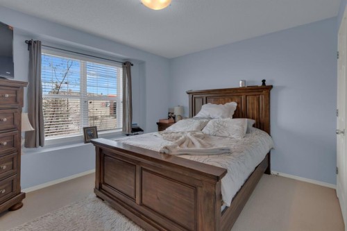 273 Eversyde Boulevard Sw, Calgary, AB - Indoor Photo Showing Bedroom