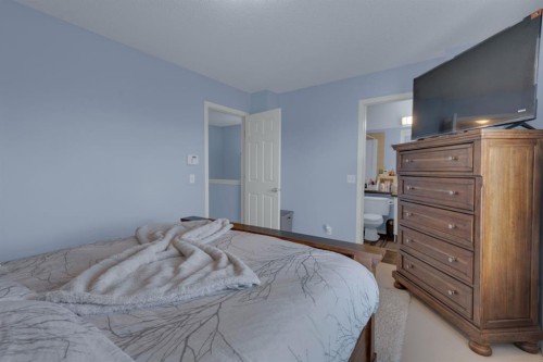273 Eversyde Boulevard Sw, Calgary, AB - Indoor Photo Showing Bedroom