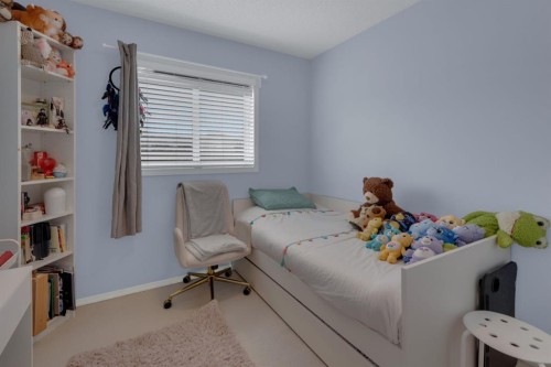 273 Eversyde Boulevard Sw, Calgary, AB - Indoor Photo Showing Bedroom