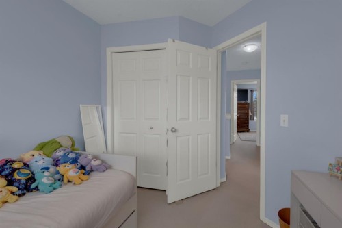 273 Eversyde Boulevard Sw, Calgary, AB - Indoor Photo Showing Bedroom