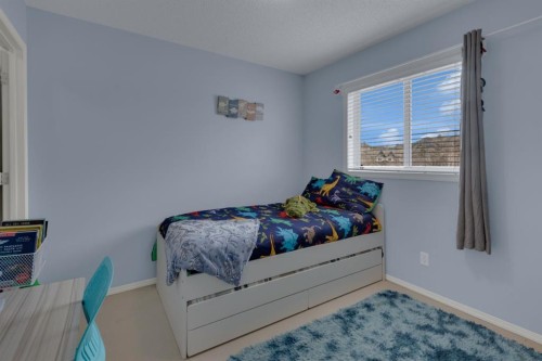 273 Eversyde Boulevard Sw, Calgary, AB - Indoor Photo Showing Bedroom
