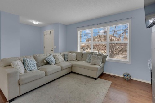 273 Eversyde Boulevard Sw, Calgary, AB - Indoor Photo Showing Living Room