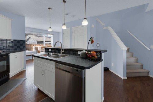 273 Eversyde Boulevard Sw, Calgary, AB - Indoor Photo Showing Kitchen With Double Sink