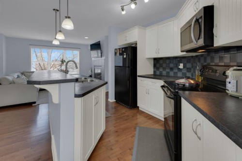 273 Eversyde Boulevard Sw, Calgary, AB - Indoor Photo Showing Kitchen With Double Sink