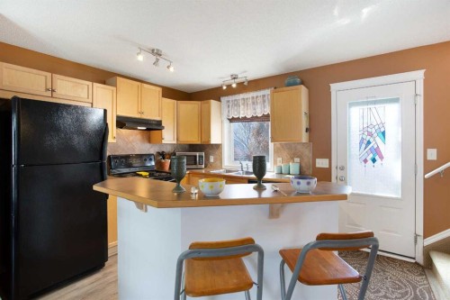 211 Prestwick Heights Se, Calgary, AB - Indoor Photo Showing Kitchen With Double Sink