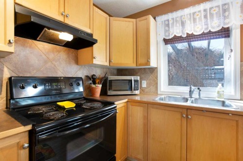 211 Prestwick Heights Se, Calgary, AB - Indoor Photo Showing Kitchen With Double Sink
