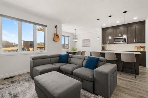 1041 Iron Landing Way, Crossfield, AB - Indoor Photo Showing Living Room
