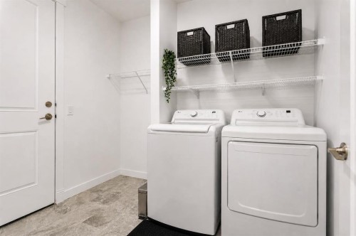 1041 Iron Landing Way, Crossfield, AB - Indoor Photo Showing Laundry Room