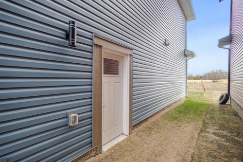 1041 Iron Landing Way, Crossfield, AB - Outdoor With Exterior