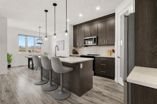 1041 Iron Landing Way, Crossfield, AB - Indoor Photo Showing Kitchen With Upgraded Kitchen