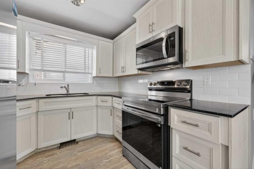 84 Macewan Glen Way Nw, Calgary, AB - Indoor Photo Showing Kitchen With Upgraded Kitchen