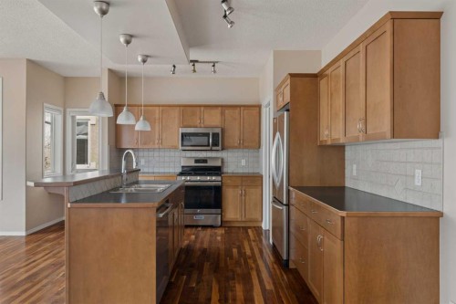 11 Valley Crest Rise Nw, Calgary, AB - Indoor Photo Showing Kitchen With Double Sink