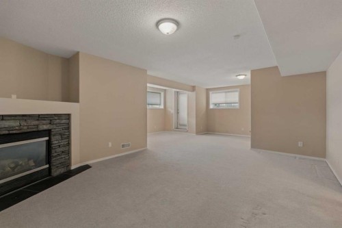 11 Valley Crest Rise Nw, Calgary, AB - Indoor Photo Showing Living Room With Fireplace