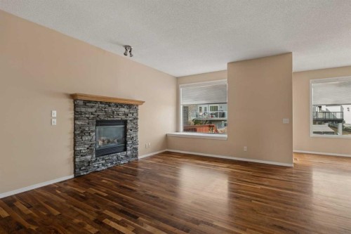 11 Valley Crest Rise Nw, Calgary, AB - Indoor Photo Showing Living Room With Fireplace