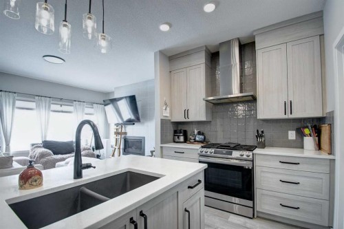 800 Mandalay Link, Carstairs, AB - Indoor Photo Showing Kitchen With Double Sink