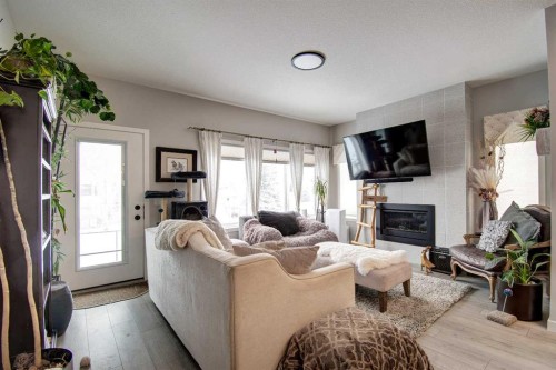 800 Mandalay Link, Carstairs, AB - Indoor Photo Showing Living Room With Fireplace