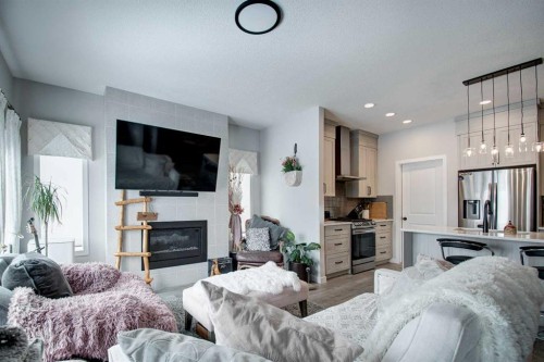800 Mandalay Link, Carstairs, AB - Indoor Photo Showing Living Room With Fireplace