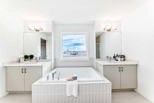 64 Creekside Path Sw, Calgary, AB - Indoor Photo Showing Laundry Room