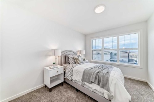64 Creekside Path Sw, Calgary, AB - Indoor Photo Showing Bedroom