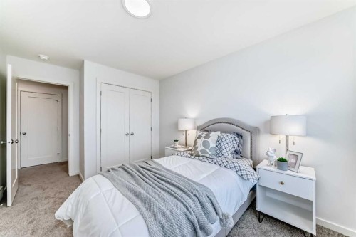 64 Creekside Path Sw, Calgary, AB - Indoor Photo Showing Bedroom