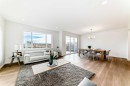 64 Creekside Path Sw, Calgary, AB  - Indoor Photo Showing Living Room 