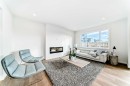 64 Creekside Path Sw, Calgary, AB  - Indoor Photo Showing Living Room With Fireplace 