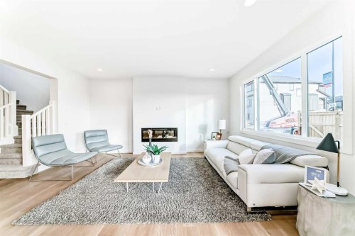 64 Creekside Path Sw, Calgary, AB - Indoor Photo Showing Living Room With Fireplace