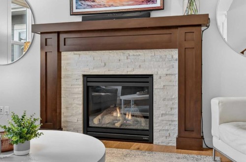 19 Cranbrook Crescent Se, Calgary, AB - Indoor Photo Showing Living Room With Fireplace