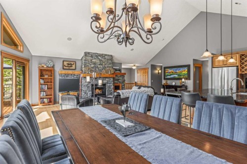 116 Casale Place, Canmore, AB - Indoor Photo Showing Dining Room With Fireplace