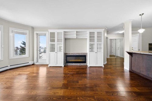 3402-3402 Hawksbrow Point Nw, Calgary, AB - Indoor With Fireplace