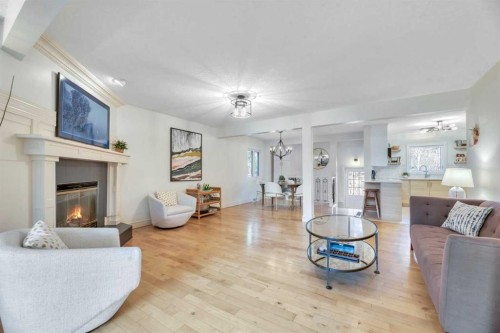 48 Waterloo Drive Sw, Calgary, AB - Indoor Photo Showing Living Room With Fireplace