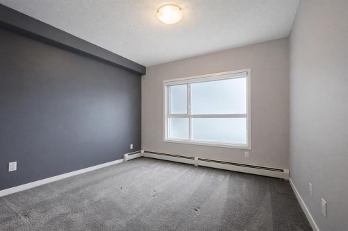 109-4150 Seton Drive Se, Calgary, AB - Indoor Photo Showing Other Room