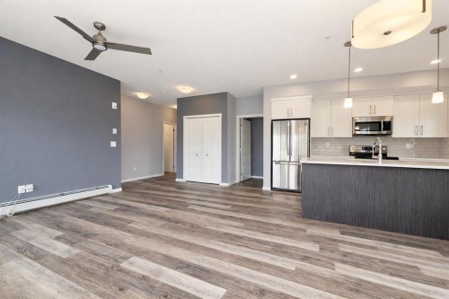 109-4150 Seton Drive Se, Calgary, AB - Indoor Photo Showing Kitchen With Stainless Steel Kitchen With Upgraded Kitchen