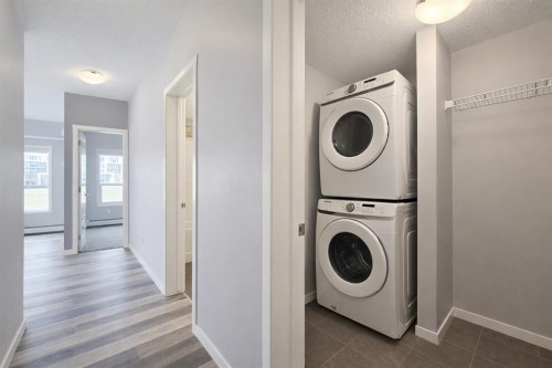 109-4150 Seton Drive Se, Calgary, AB - Indoor Photo Showing Laundry Room