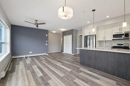 109-4150 Seton Drive Se, Calgary, AB - Indoor Photo Showing Kitchen With Upgraded Kitchen