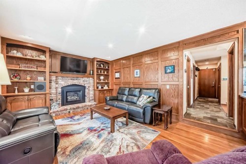 29 Deer River Green Se, Calgary, AB - Indoor Photo Showing Living Room With Fireplace