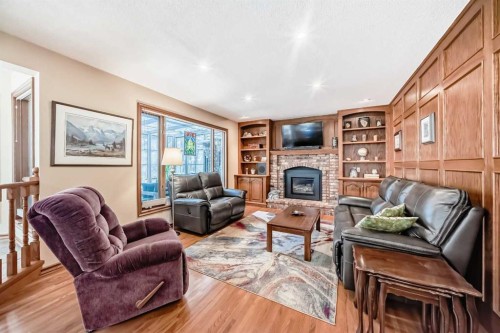 29 Deer River Green Se, Calgary, AB - Indoor Photo Showing Living Room With Fireplace