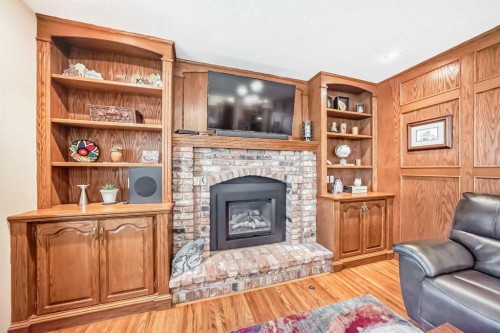 29 Deer River Green Se, Calgary, AB - Indoor Photo Showing Living Room With Fireplace