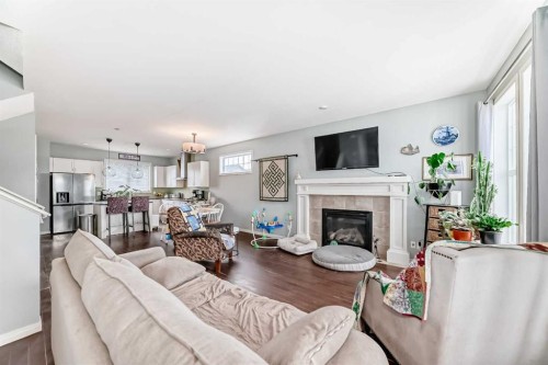 404 Redstone Grove Ne, Calgary, AB - Indoor Photo Showing Living Room With Fireplace