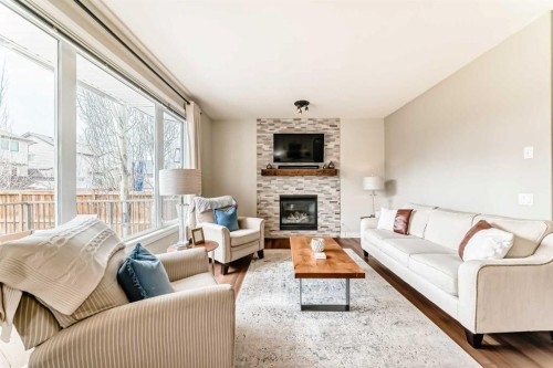 127 Cimarron Park Circle, Okotoks, AB - Indoor Photo Showing Living Room With Fireplace